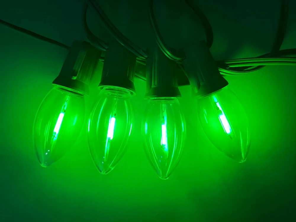 C9 green bulbs lit in a real test setup